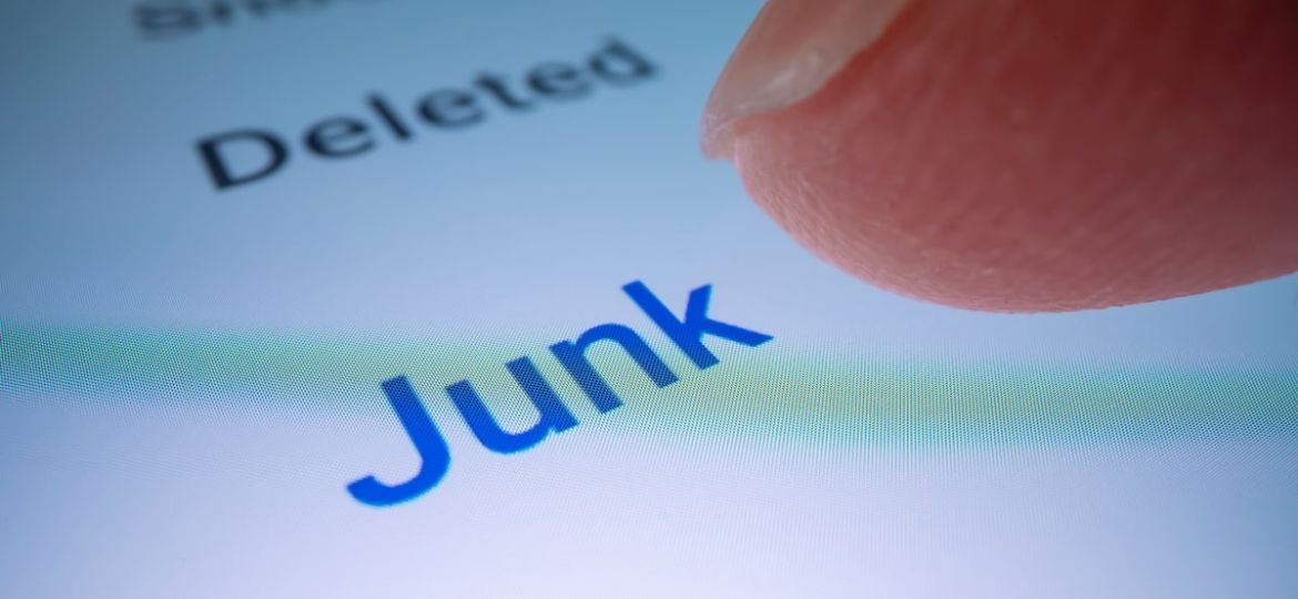 person clicking on the junk folder icon on their phone
