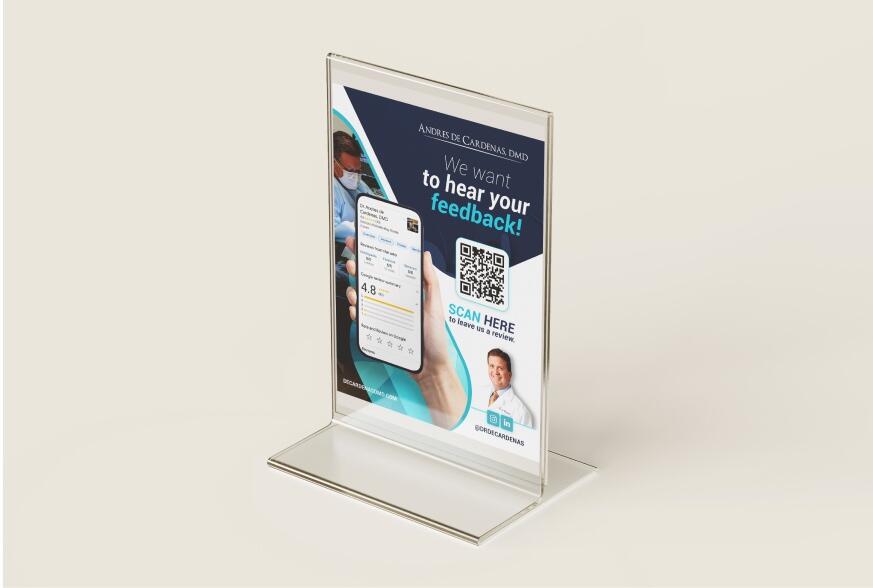Clear acrylic tabletop sign with a feedback message and QR code for customer engagement.