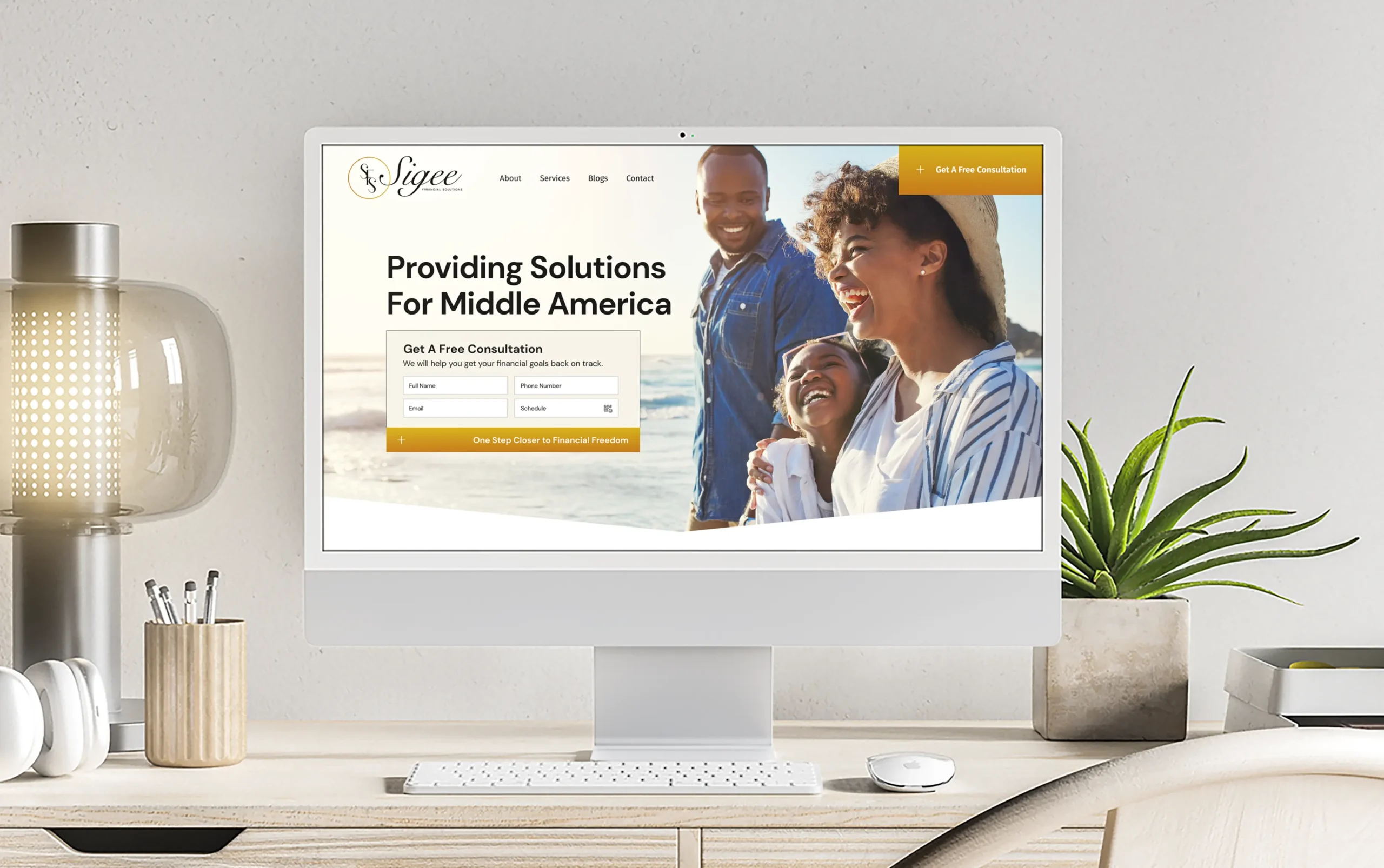 Modern desk setup with computer displaying a website offering solutions for Middle America.