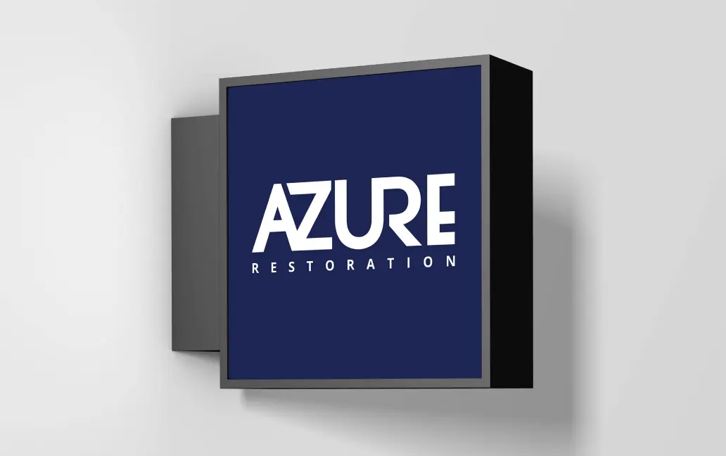 Azure Restoration logo on a sleek wall-mounted sign against a neutral background.