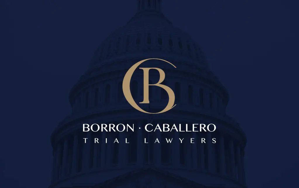 Borron Caballero logo with elegant gold lettering on a dark background, symbolizing professional legal services.