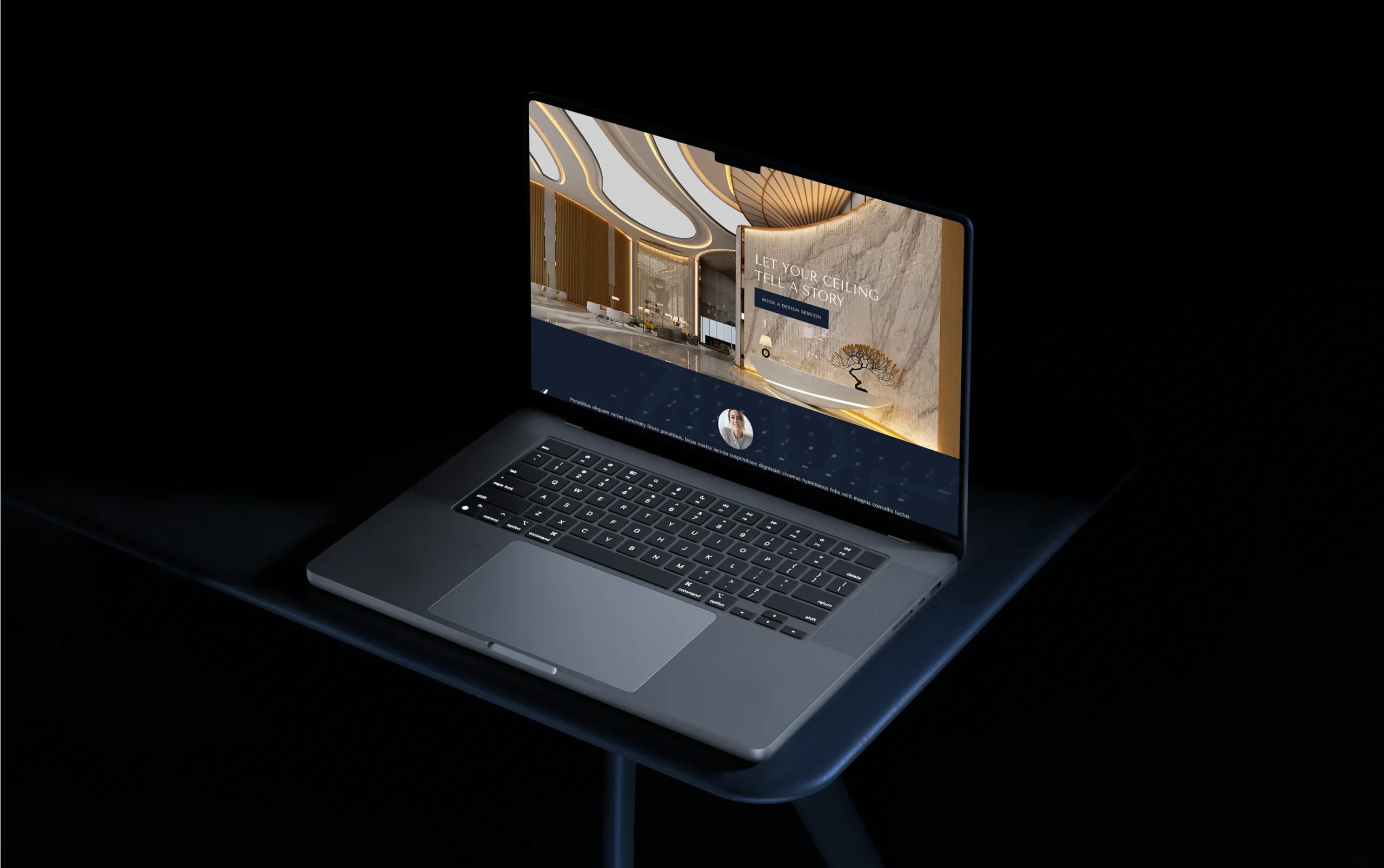 Sleek laptop on a dark table displaying an elegant website with architectural elements.