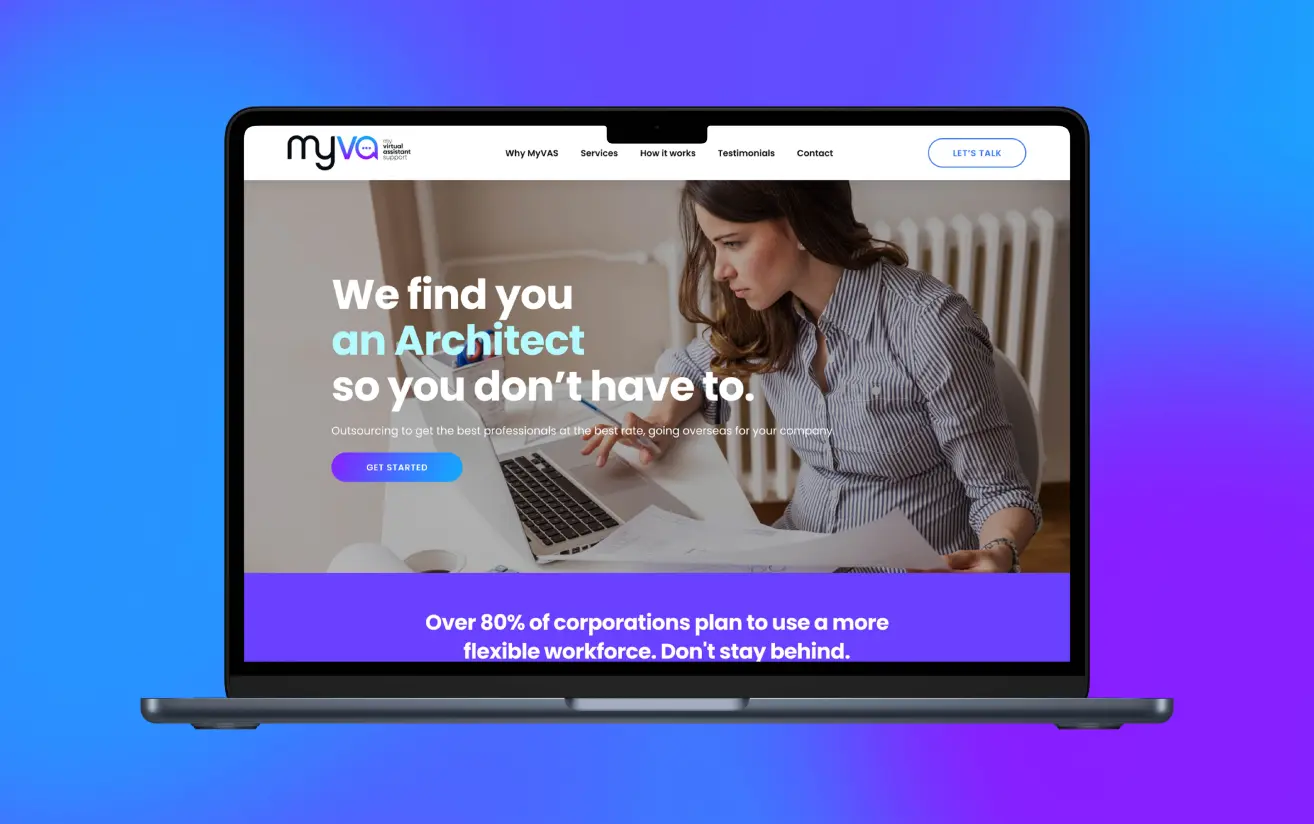 Laptop displaying a marketing services website with vibrant blue and purple background.