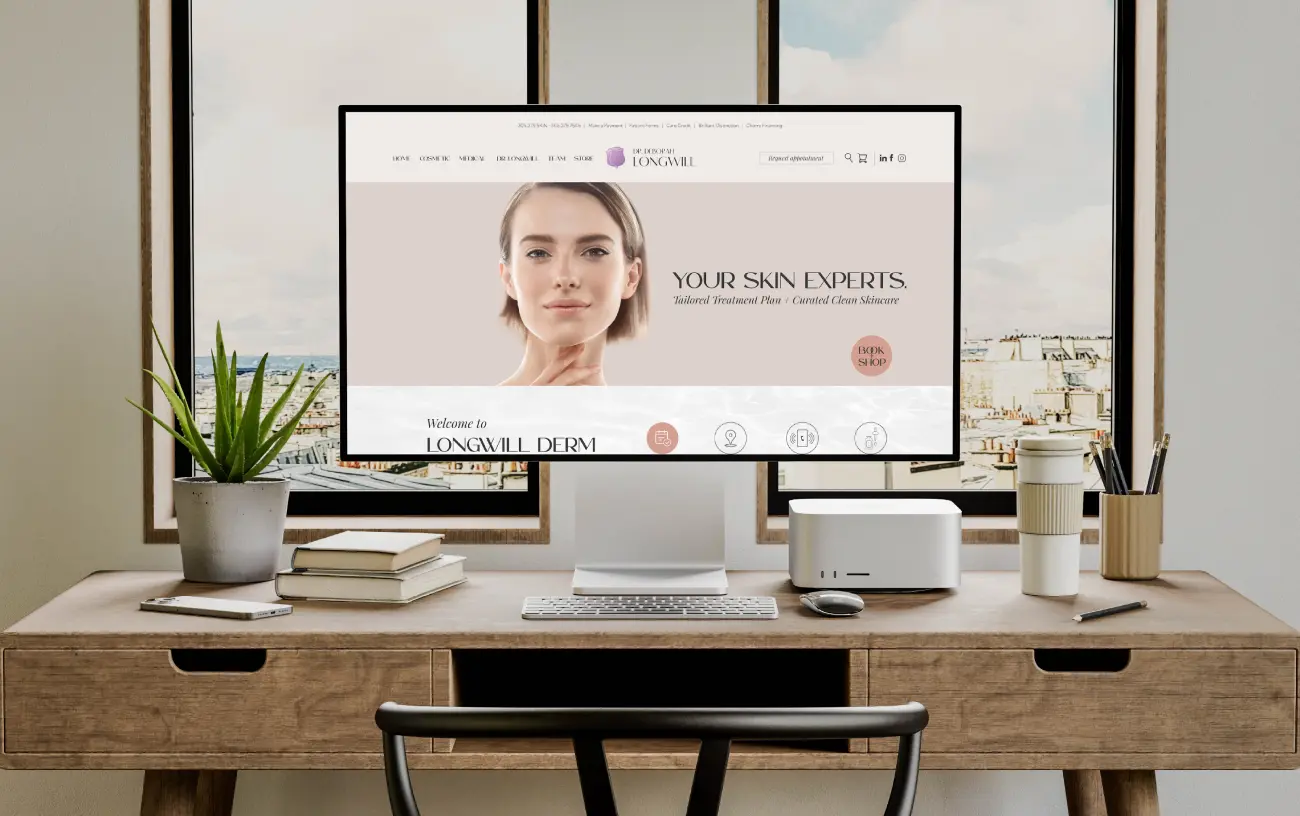 Modern workspace with a computer on a wooden desk featuring a skincare website.