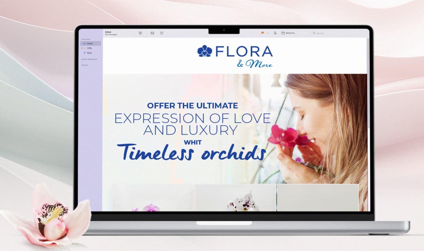 Woman admiring orchids on a laptop screen with floral branding.