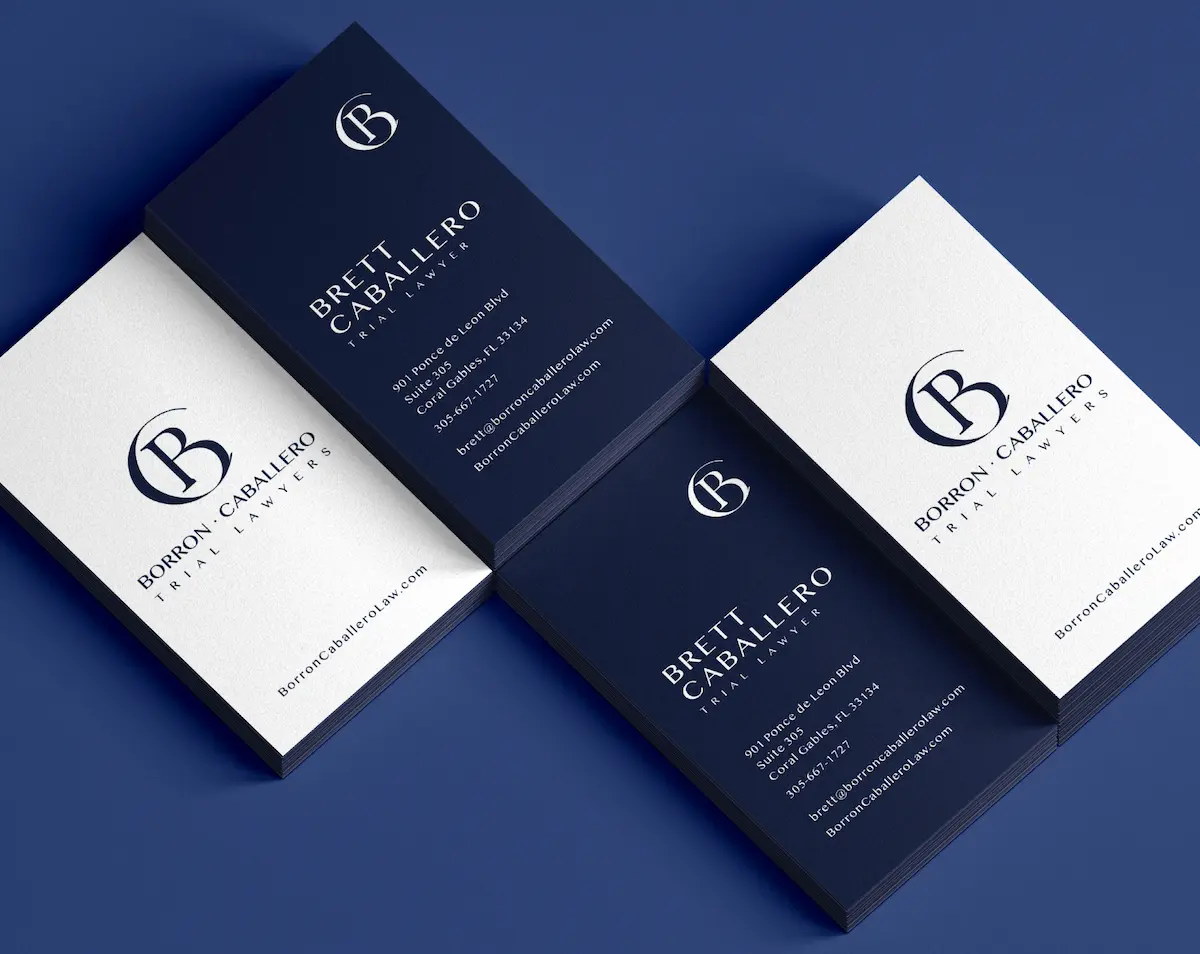 Elegant business cards with a modern design on a blue background.