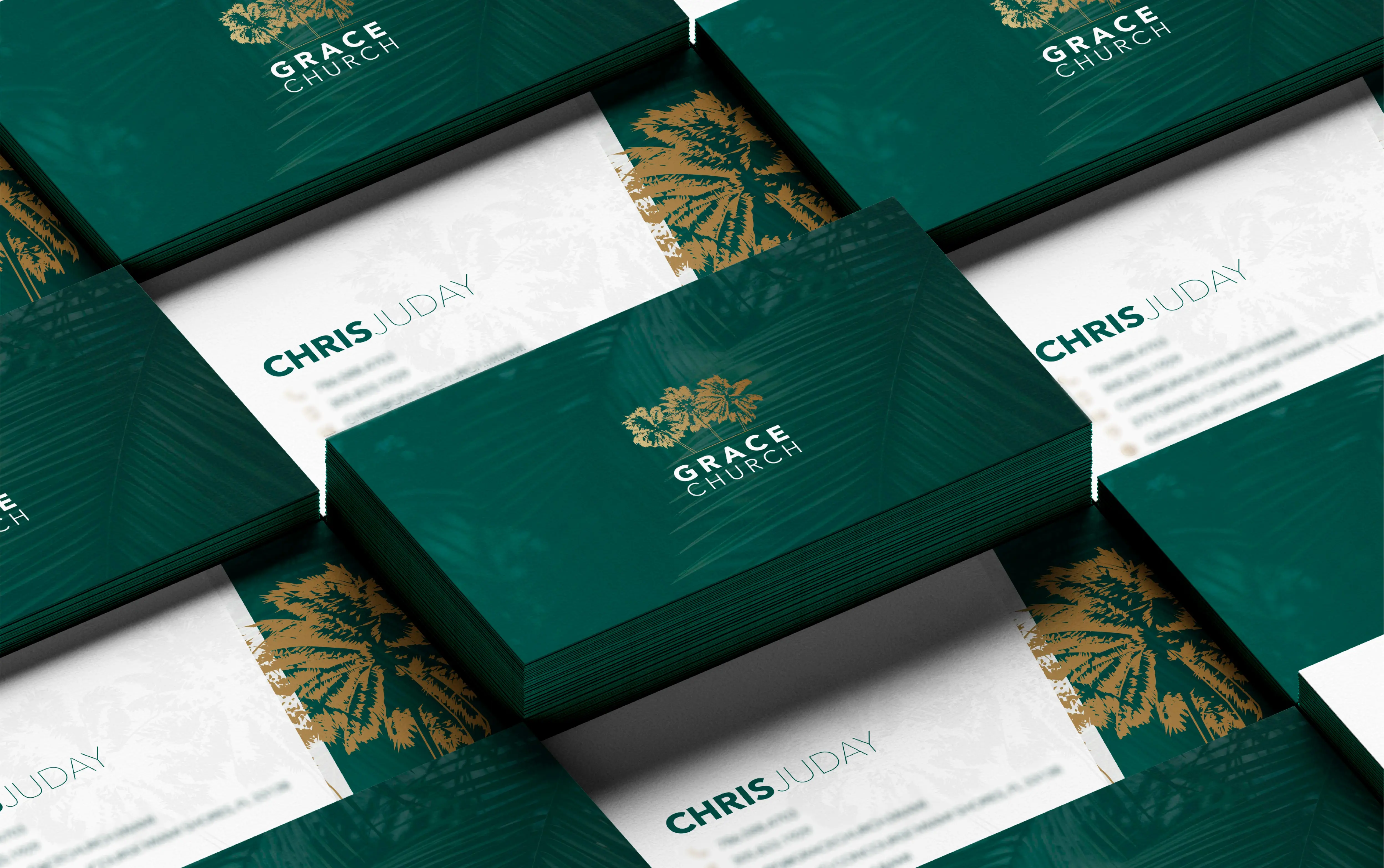 Green and white business cards with elegant gold accents, featuring the logo and name 