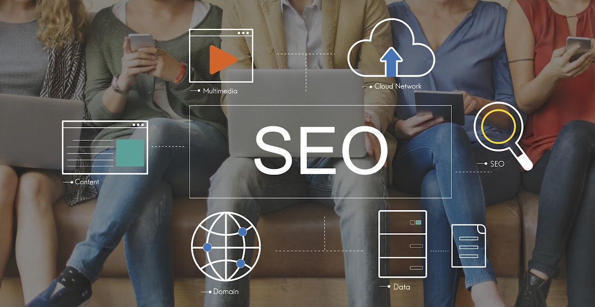 Group of people working on laptops and devices with SEO and digital technology icons overlay.